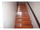 Wood stairs with dark brown handrail at 2315 W Union Hills Dr # 112, Phoenix, AZ 85027