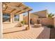 Landscaped backyard features a fire pit and pergola at 2613 E Bart St, Gilbert, AZ 85295