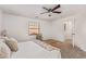 Bedroom with a queen bed, ceiling fan, and a window with blinds at 2613 E Bart St, Gilbert, AZ 85295