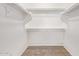 Large walk-in closet with double hanging rods and neutral carpeting at 2613 E Bart St, Gilbert, AZ 85295