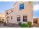 Tan two-story house with a walkway and shrubs at 2613 E Bart St, Gilbert, AZ 85295