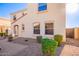 Tan two-story house with walkway and landscaping at 2613 E Bart St, Gilbert, AZ 85295