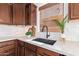 Kitchen sink and countertop with a modern black faucet and white quartz countertop at 2613 E Bart St, Gilbert, AZ 85295