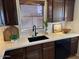 Modern kitchen with dark wood cabinets and a stylish sink at 2613 E Bart St, Gilbert, AZ 85295