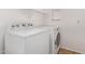 Convenient laundry room with Whirlpool washer and dryer at 2613 E Bart St, Gilbert, AZ 85295