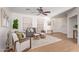 Living room with gray couch and wood-look floors at 2613 E Bart St, Gilbert, AZ 85295