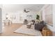 Living room with wood floors, gray couch, and rug at 2613 E Bart St, Gilbert, AZ 85295