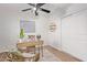 Home office with wood desk, wicker chair, and world map decor at 2613 E Bart St, Gilbert, AZ 85295