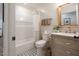 Updated bathroom features a pedestal sink, shower/tub combo, and stylish tile floor at 2649 N Granite Reef Rd, Scottsdale, AZ 85257