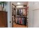 Large walk-in closet with ample shelving and hanging space at 2649 N Granite Reef Rd, Scottsdale, AZ 85257