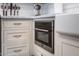 Built-in microwave and white shaker cabinets in a corner kitchen at 2649 N Granite Reef Rd, Scottsdale, AZ 85257