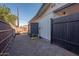 Brick pathway and wood fence leading to the backyard at 2649 N Granite Reef Rd, Scottsdale, AZ 85257