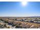 Aerial view of neighborhood with mountain range in background at 26538 N 132Nd Ln, Peoria, AZ 85383