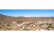 Aerial view of neighborhood with mountain range in background at 26538 N 132Nd Ln, Peoria, AZ 85383