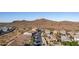 Aerial view of neighborhood with desert landscape in background at 26538 N 132Nd Ln, Peoria, AZ 85383