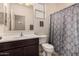 Clean bathroom with single vanity, toilet, and shower/tub combo at 26538 N 132Nd Ln, Peoria, AZ 85383