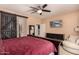 Spacious bedroom with a large bed, dresser, and comfy armchair at 26538 N 132Nd Ln, Peoria, AZ 85383