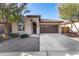 Single-story home with a two-car garage and well-maintained landscaping at 26538 N 132Nd Ln, Peoria, AZ 85383