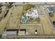 Aerial view of house, pool, and large lot with outbuildings at 2889 E Tremaine Ave, Gilbert, AZ 85234