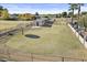 Large grassy backyard with storage shed and satellite dish at 2889 E Tremaine Ave, Gilbert, AZ 85234