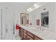 Bathroom with double vanity, wood cabinets, and a toilet at 2889 E Tremaine Ave, Gilbert, AZ 85234