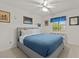 Bedroom with queen bed and ceiling fan at 2889 E Tremaine Ave, Gilbert, AZ 85234