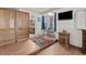 Main bedroom with built-in wood cabinets and sitting area at 2889 E Tremaine Ave, Gilbert, AZ 85234