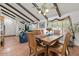 Bright dining room features wood table and chairs, adjacent to living area at 2889 E Tremaine Ave, Gilbert, AZ 85234