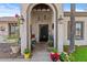 Elegant entryway with arched doorway and wrought-iron door at 2889 E Tremaine Ave, Gilbert, AZ 85234