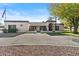 Single-story home with stucco exterior, large driveway, and mature landscaping at 2889 E Tremaine Ave, Gilbert, AZ 85234