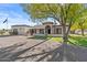 Ranch home with mature tree and flagpole at 2889 E Tremaine Ave, Gilbert, AZ 85234