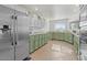 Kitchen with stainless steel appliances and green cabinets at 2889 E Tremaine Ave, Gilbert, AZ 85234