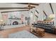 Living room with fireplace, high ceilings and wood flooring at 2889 E Tremaine Ave, Gilbert, AZ 85234