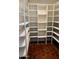 Walk-in pantry with ample shelving for storage at 2889 E Tremaine Ave, Gilbert, AZ 85234