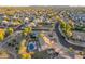 Aerial view of a house with a pool, situated in a quiet residential neighborhood at 2921 S Martingale Rd, Gilbert, AZ 85295