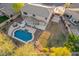 Aerial view showcasing a house's backyard oasis, complete with a pool and patio at 2921 S Martingale Rd, Gilbert, AZ 85295