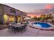 Entertain in style with this backyard pool, patio furniture, and string lights at 2921 S Martingale Rd, Gilbert, AZ 85295