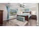 Bright bedroom with wood flooring and a ceiling fan at 2921 S Martingale Rd, Gilbert, AZ 85295