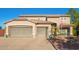 Two-story house with three-car garage and desert landscaping at 2921 S Martingale Rd, Gilbert, AZ 85295