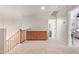 Upstairs hallway with wood cabinets and carpet flooring at 2921 S Martingale Rd, Gilbert, AZ 85295