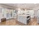 Spacious kitchen with island, granite countertops, and white cabinets at 2921 S Martingale Rd, Gilbert, AZ 85295