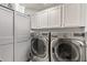 Bright laundry room, featuring LG washer and dryer, and ample storage at 2921 S Martingale Rd, Gilbert, AZ 85295