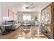 Elegant living room with hardwood floors, a gray sofa, and stylish decor at 2921 S Martingale Rd, Gilbert, AZ 85295