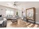 Bright living room with hardwood floors, neutral colors, and ample natural light at 2921 S Martingale Rd, Gilbert, AZ 85295