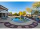 Relaxing pool area with a blue tiled pool and surrounding landscaping at 2921 S Martingale Rd, Gilbert, AZ 85295