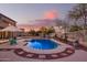 Stunning pool with a large patio and charming string lights at 2921 S Martingale Rd, Gilbert, AZ 85295