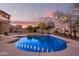 Relaxing pool area with string lights and beautiful sunset views at 2921 S Martingale Rd, Gilbert, AZ 85295