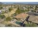 Aerial view showing the house, pool, and surrounding neighborhood at 30034 N 128Th Ave, Peoria, AZ 85383