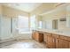 Double vanity bathroom with soaking tub and walk-in shower at 30034 N 128Th Ave, Peoria, AZ 85383