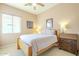 Charming bedroom with wood furniture and a desk area at 30034 N 128Th Ave, Peoria, AZ 85383